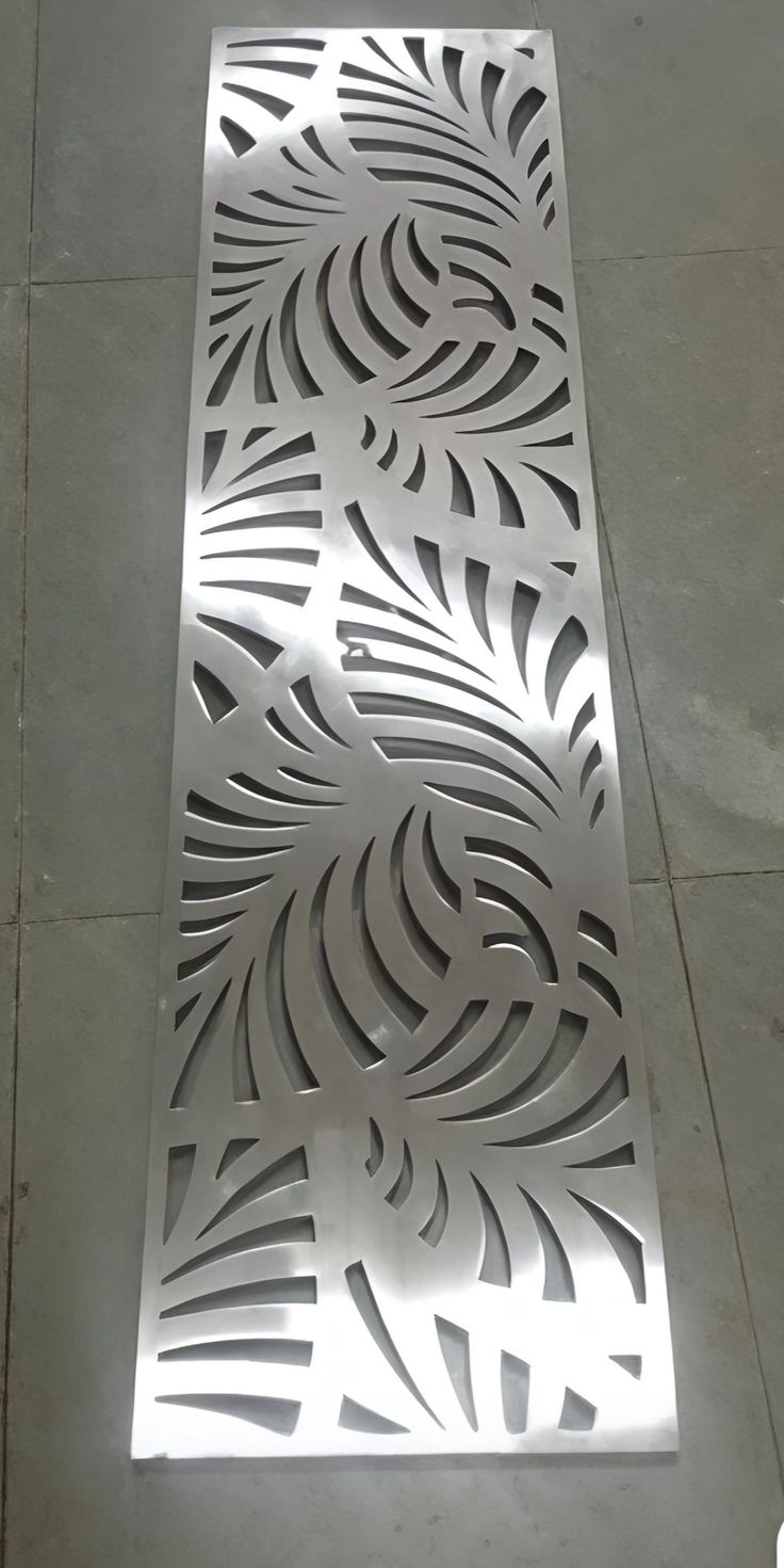 Decorative stainless steel leaf pattern showing surface finish