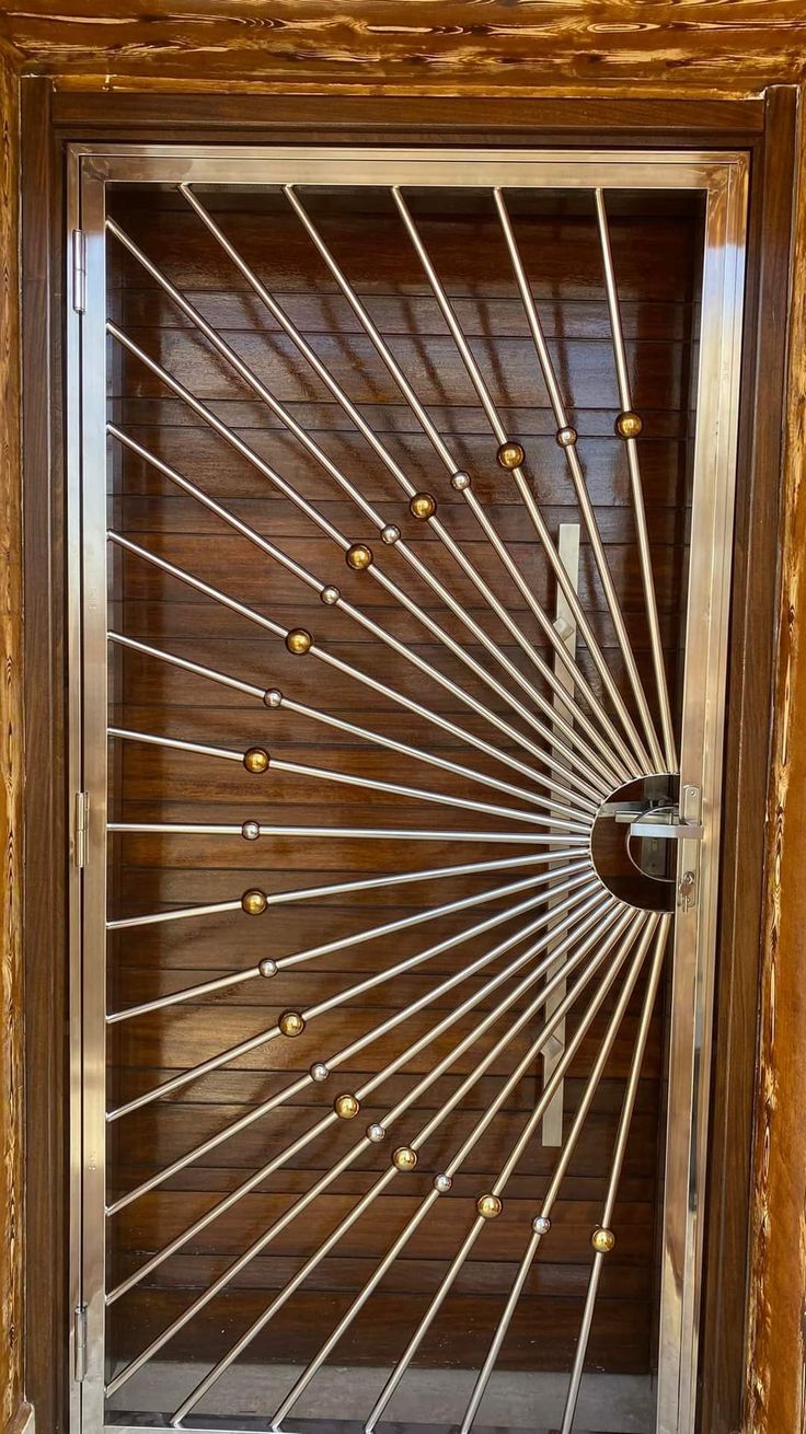 Sunburst pattern stainless steel gate showing finish quality