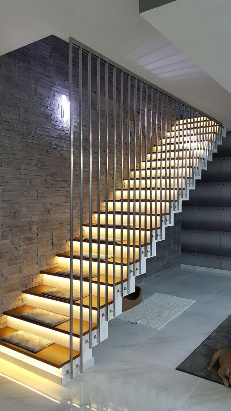 LED-lit luxury staircase railing in hospitality setting